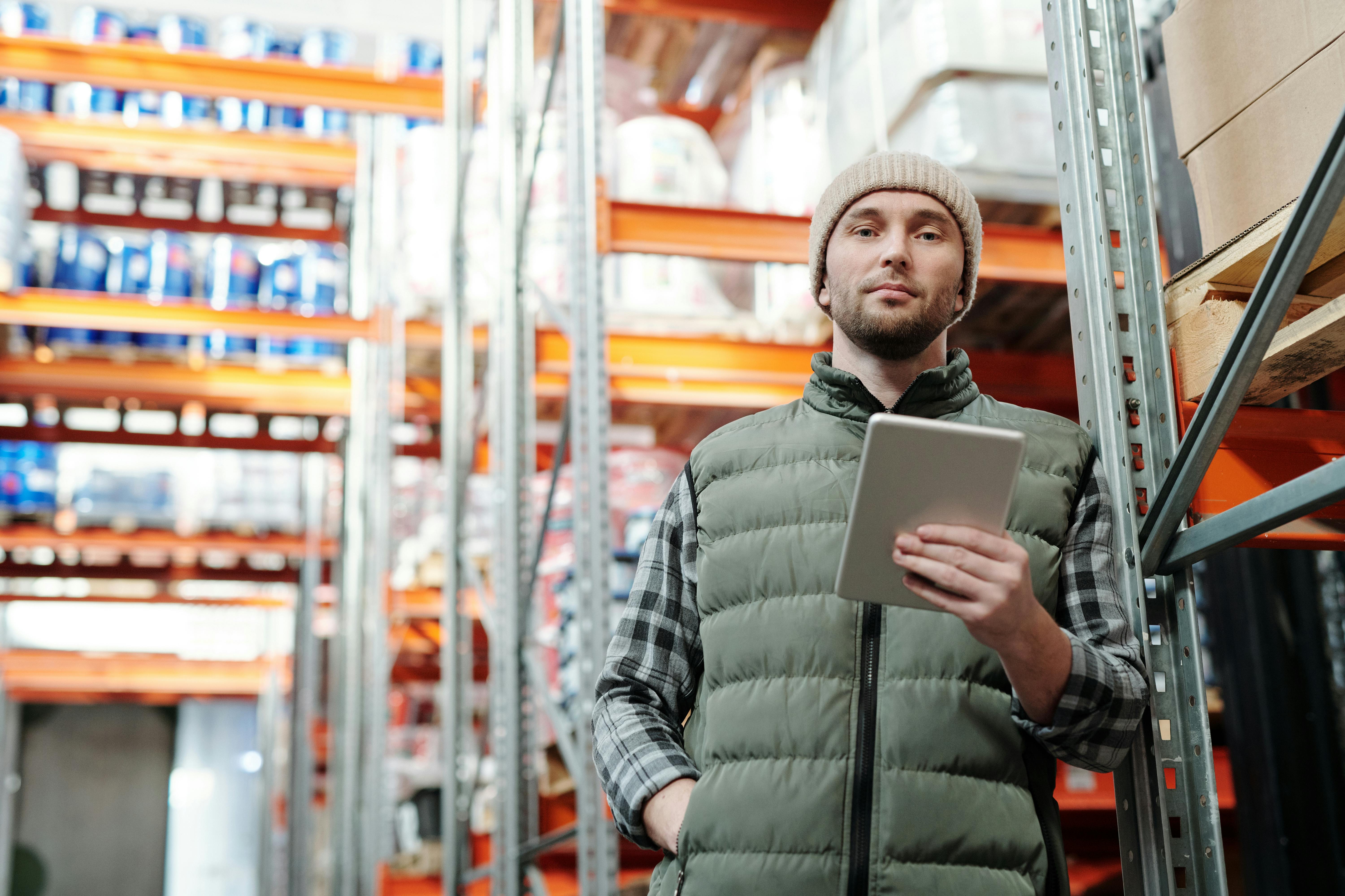 Warehouse worker using Purple Stock on a tablet